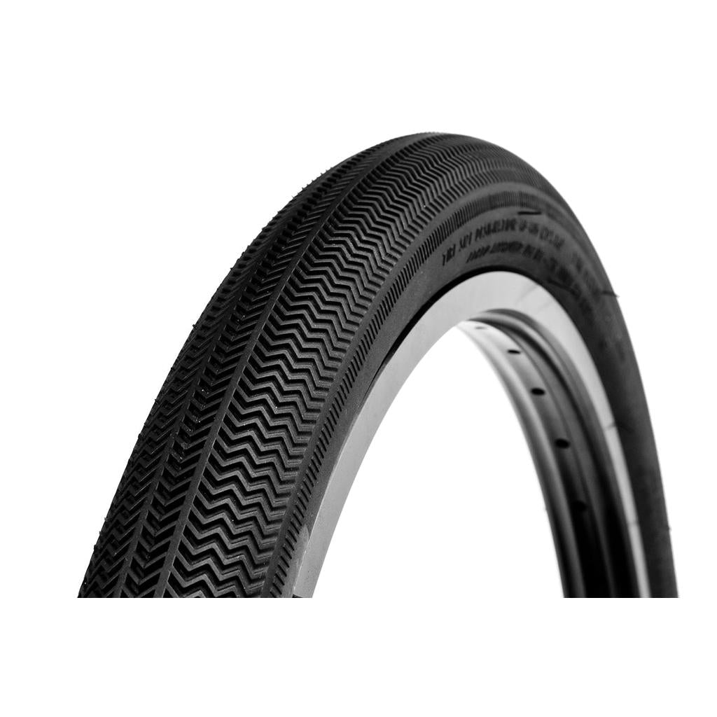 Close-up of an Alienation TCS R1 Tyre on a white background, featuring directional textured tread and a tubeless compatible system.