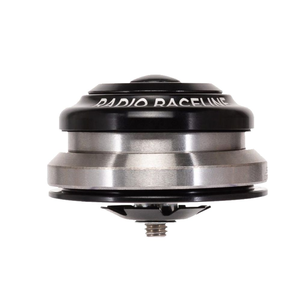 A metal Radio Raceline 1-1/8 - 1.5 Inch Integrated Headset with the words "RADIO RACELINE" engraved on the CNC machined top cap, boasting high-precision bearings for a smooth ride.