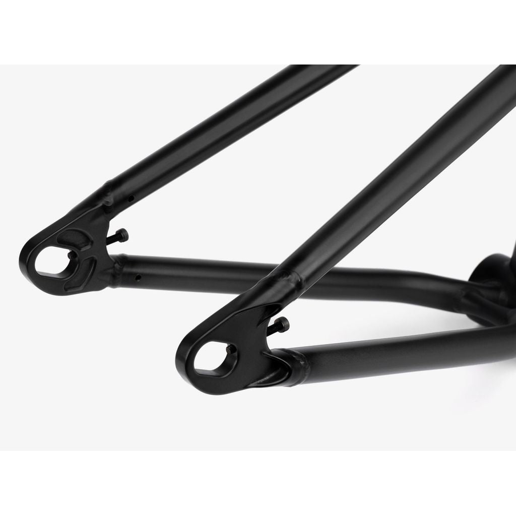 Close-up of a black bicycle frame showcasing the Wethepeople Tomorrow Frame's dropout and rear triangle, highlighting sleek Thru-Axle (TA) hubs.