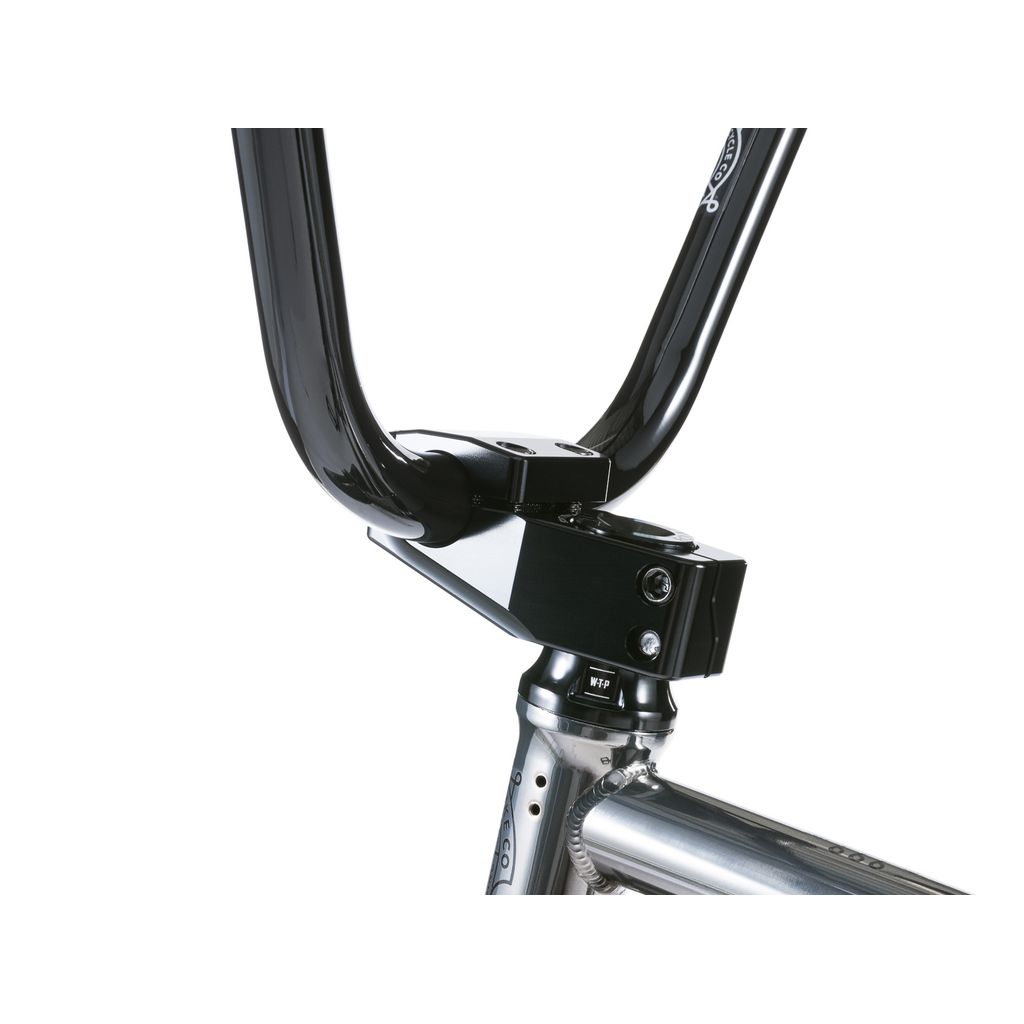 Close-up of a black bicycle stem and handlebars on the shiny metallic frame of a Wethepeople Envy 20 Inch BMX Bike, highlighting Eclat parts as true BMX masterpieces.