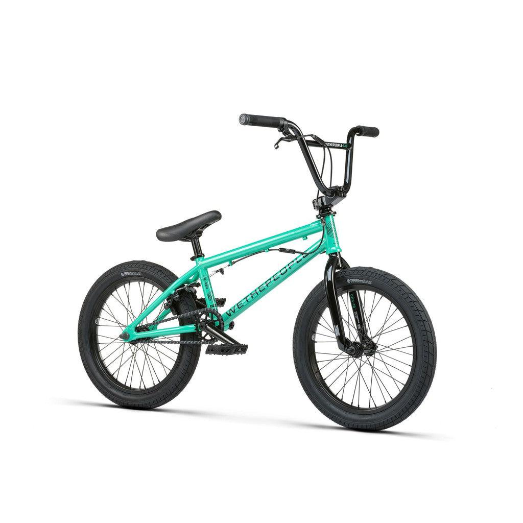 The Wethepeople CRS FS 18 Inch BMX bike is bright green with a salt rotor setup, and features sleek black handlebars, seat, and tires against a white background.