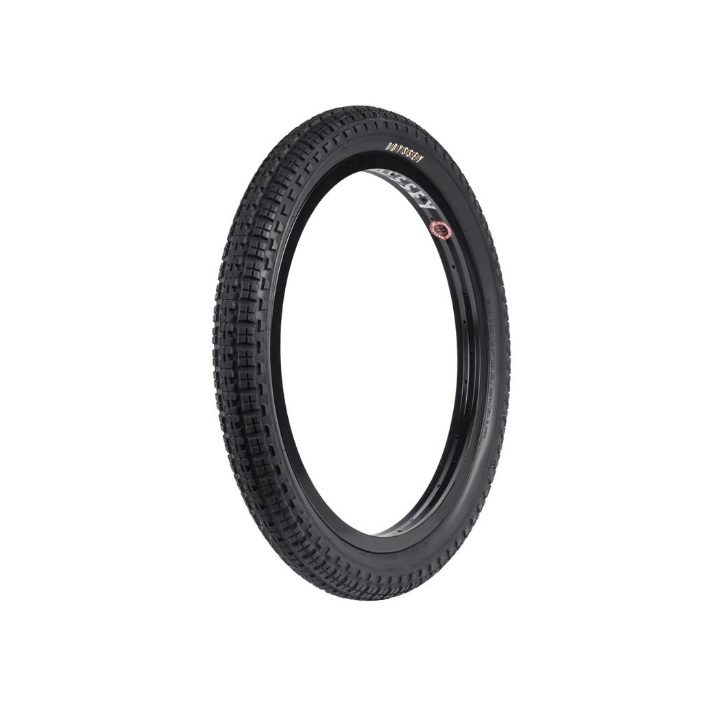 A black Odyssey Aitken Knobby Tyre is showcased with its knobby tread pattern against a crisp white background.