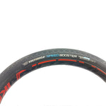 Close-up of a bicycle tire displaying the branding labels "Vee Speedbooster Elite" and "FAST 50," set against a white background.