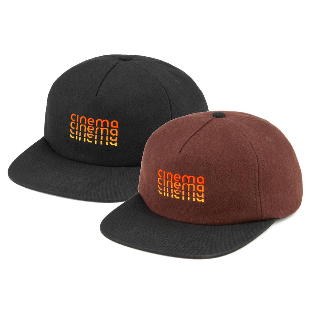 Two Cinema Stack Melton Wool Caps with flat brims, one black and one brown, each display "cinema" repeated thrice in vibrant orange retro embroidery on the front, combining style and comfort for a standout look.