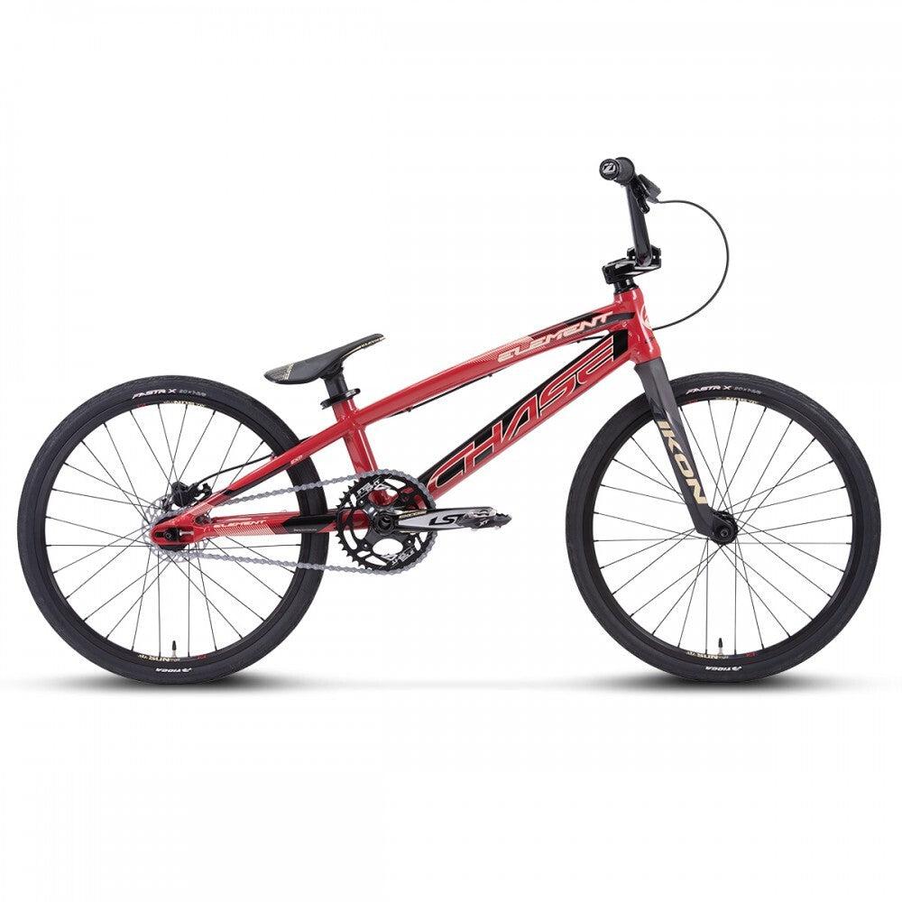 Introducing the Chase Element Expert Bike: a striking red BMX outfitted with a lightweight Expert XL frame. It comes equipped with black wheels, a sleek saddle, and features an emblazoned "Chase Element" label on the frame. This model boasts a crossbar handlebar paired with Ikon carbon forks for enhanced performance.