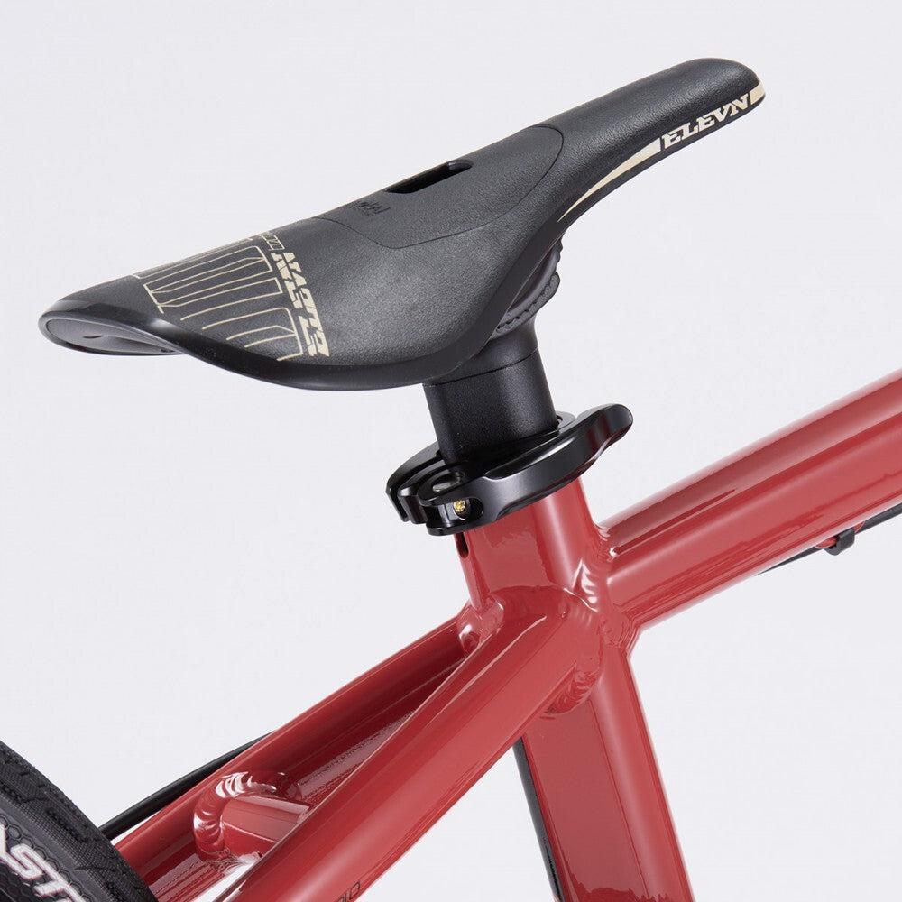 Close-up view of the red frame of the Chase Element Pro XXL Bike, specifically focusing on the seat and saddle area. It features a black saddle with the brand name "ELEVN" visible.