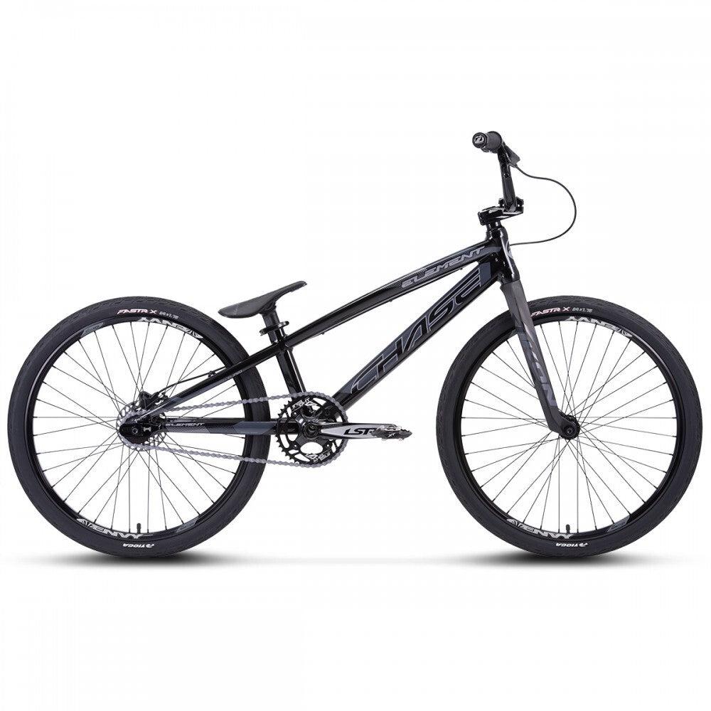 The Chase Element Pro Cruiser Bike is a black BMX racing bike featuring a sleek Expert XL frame, knobby tires, and high handlebars. It showcases the brand name "Chase" on the frame and comes equipped with Ikon carbon forks for enhanced performance.