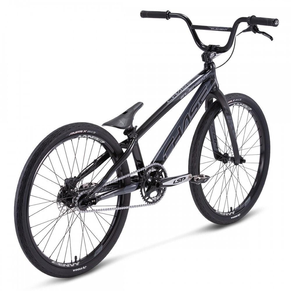 A black Chase Element Pro Cruiser race bike with thick tires, a straight handlebar, and a slim saddle, featuring an Expert XL frame and Ikon carbon forks ideal for off-road cycling and stunts.