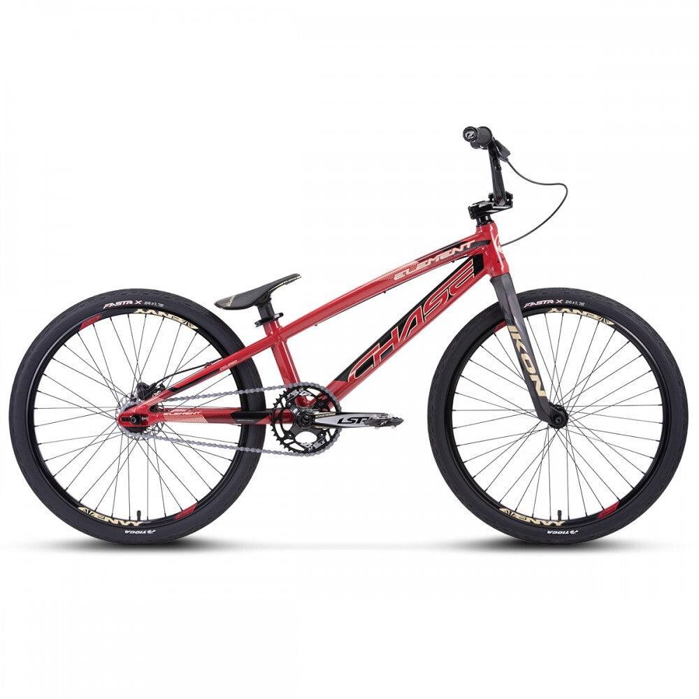 A Chase Element Pro Cruiser bike, featuring a red BMX frame with black wheels and white "Chase" branding on the Expert XL frame, is displayed against a white background. The bike includes Ikon carbon forks, flat pedals, a single gear, and front and rear brake levers.