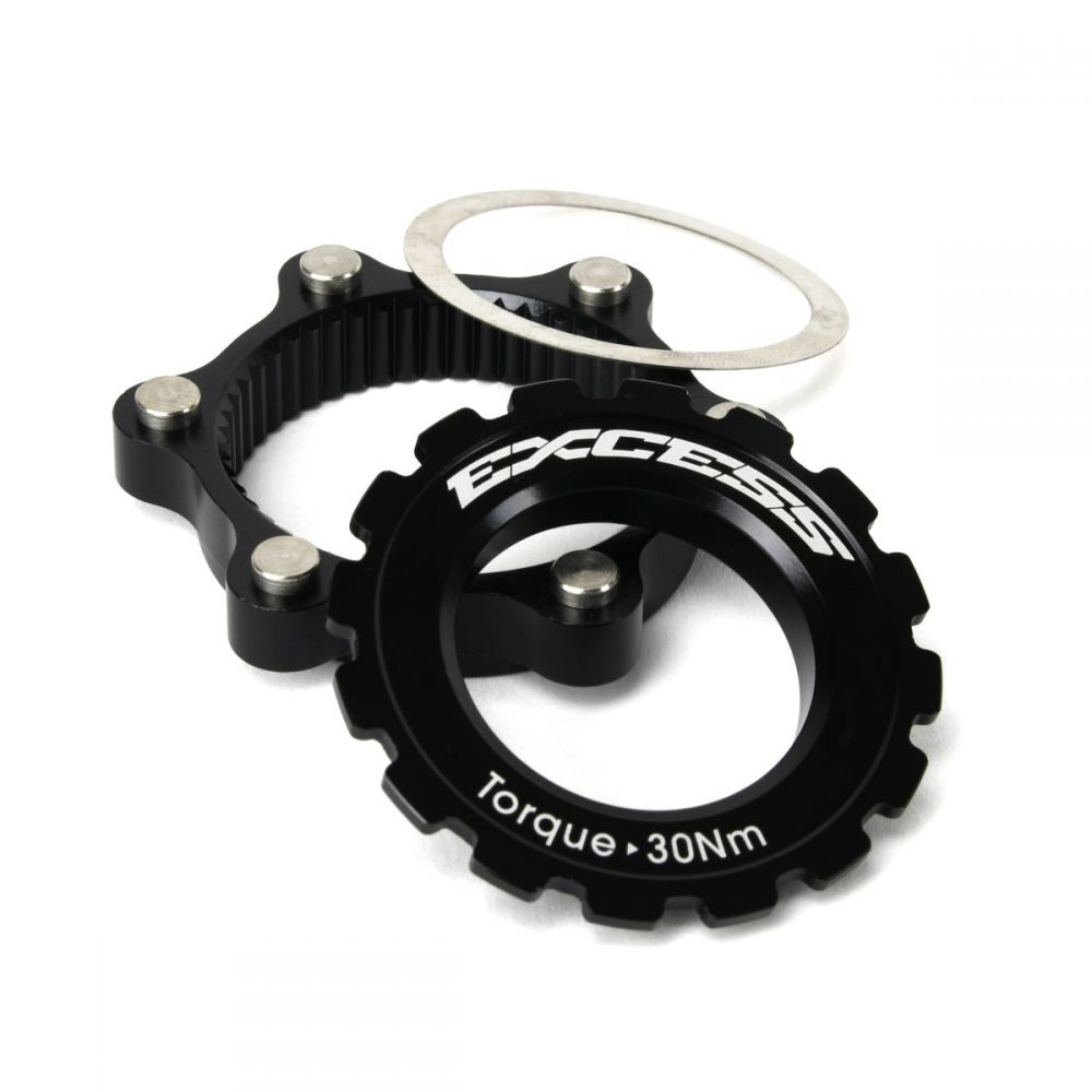 Excess Centerlock ISO Adapter Kit includes a black sprocket and ring labeled "Torque 30Nm," complemented by a bolted support ring, thin metal washer, and a 6-bolt disc brake rotor for secure braking performance.