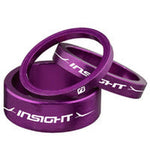 Three Insight Head Set Spacers 1-1/8" Alloy (3, 5 & 10mm) kits in purple, with the "Insight" brand printed in white on their sides, stacked to ensure your front end height is millimetre perfect.