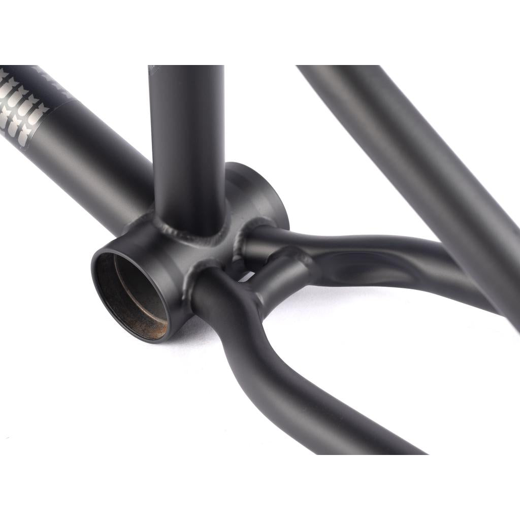 Close-up of the BSD Soulja V4 Frame (2022) in black, highlighting the precise welding and tube junctions at the bottom bracket area, complemented by SuperScoop chainstays for enhanced stability.