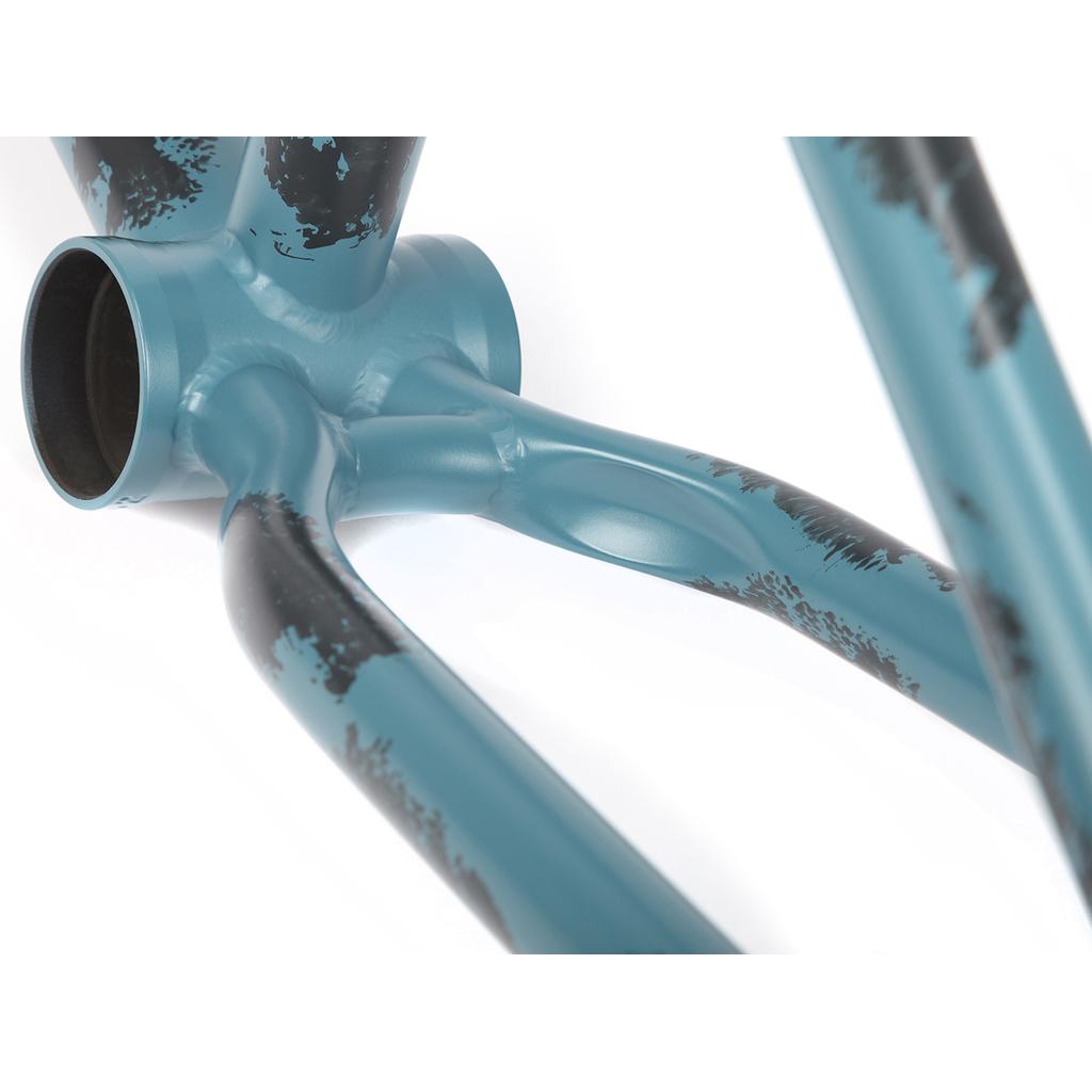 Close-up of a 2021 BSD Soulja V4 Frame, highlighting the bottom bracket with artistic paint splatters and featuring Superscoop chainstay tubing for improved performance.