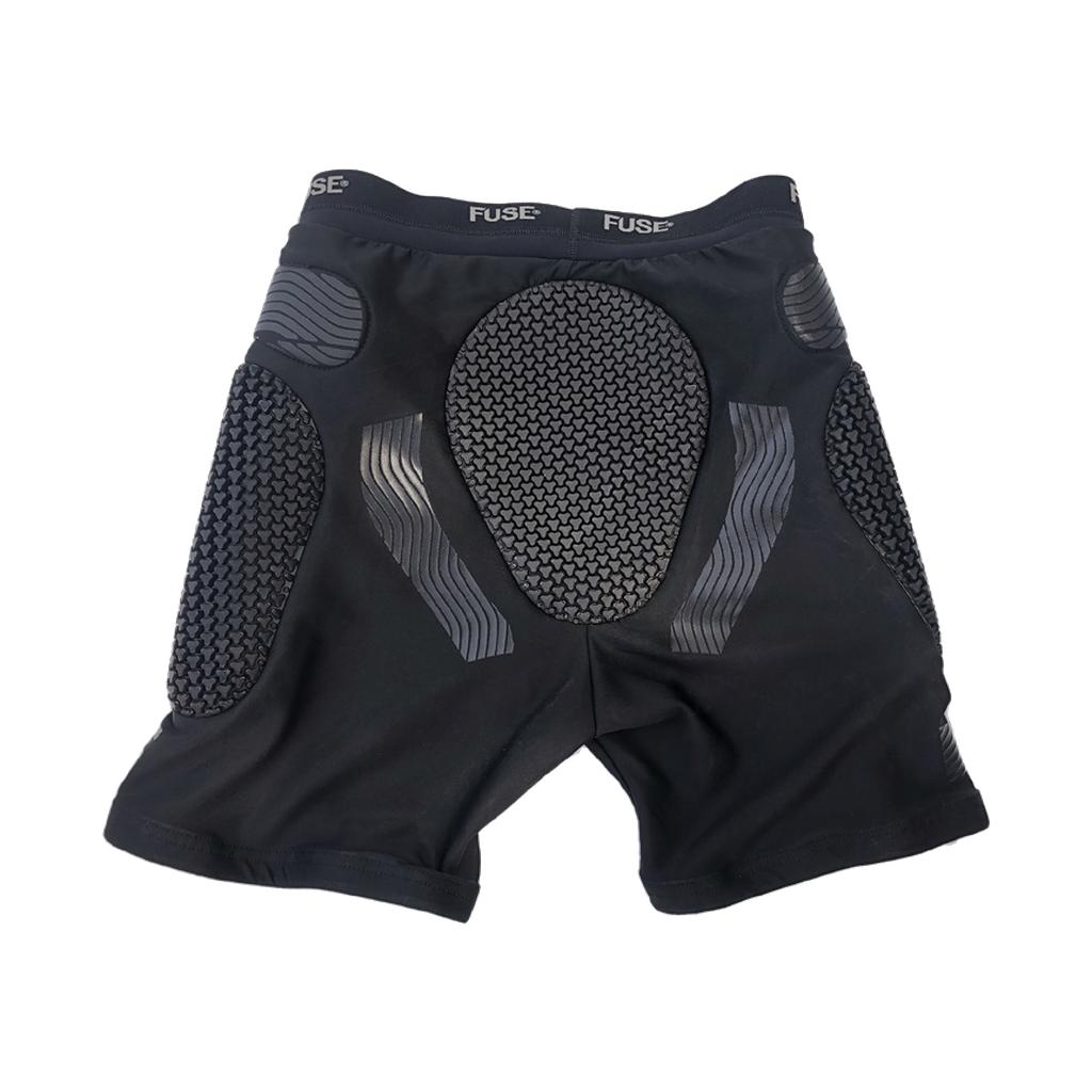 The Fuse Impact Shorts feature textured SAS-TEC padding on the hips, thighs, and tailbone, with "FUSE" branded on the waistband and advanced compression technology for superior protection.