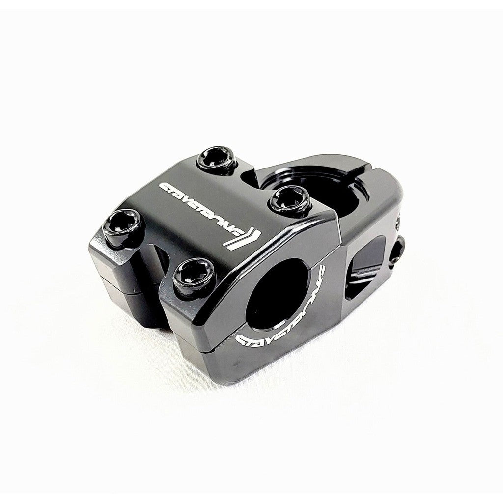 Close-up of a black bicycle stem, CNC machined from alloy, with the brand name "GRAVITY" laser-etched in white on its side. Featuring four bolts for secure attachment. Staystrong Top Line Head Stem 1 Inch.