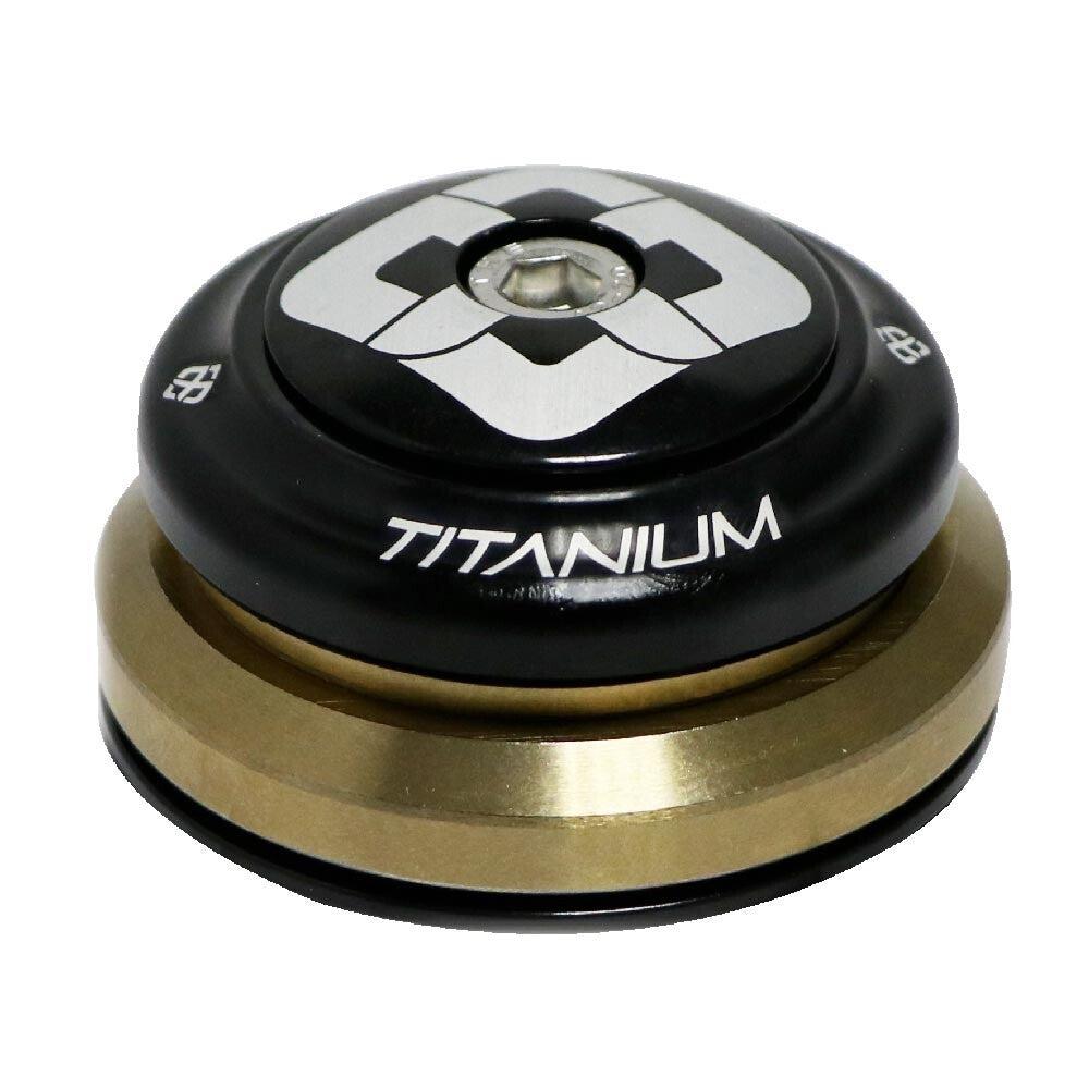 A black and gold Pride TI45 Tapered Headset with a silver pattern on top, featuring the word "TITANIUM" written in white. Upgraded with titanium bearings for smoother spins.