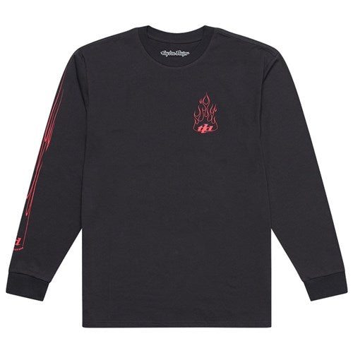 The TLD 25.1 Torched LS Shirt by Troy Lee is a black long-sleeve shirt with a small red flame graphic on the chest and bold red designs on the sleeves, making it a standout addition to any wardrobe.