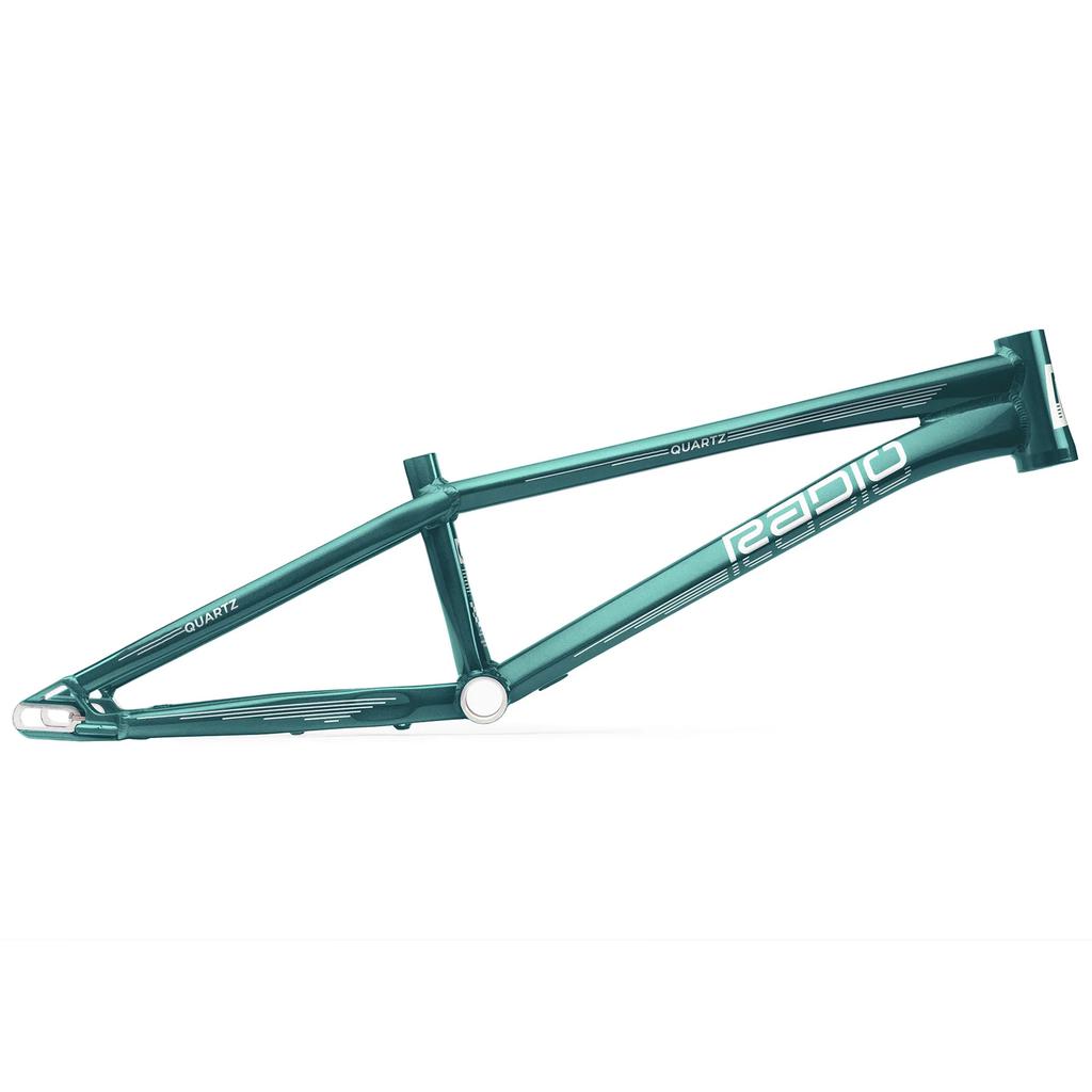 The Radio Raceline Quartz 2025 Pro XL Frame is a green BMX racing frame featuring a top tube, down tube, seat tube, and chainstays. It proudly displays the "Quartz" model name and includes an advanced Sliding Dropout Disc System for exceptional performance.