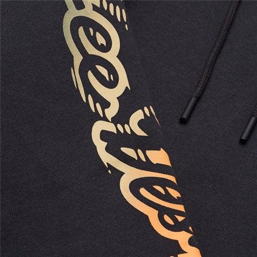 Close-up of the TLD 25.1 Peace Out Hoodie in black, featuring metallic gold detailing and black drawstrings, ideal for winter warmth.