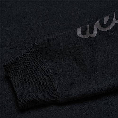 Close-up of the TLD 25.1 Branded Hoodie's black sleeve features a ribbed cuff with glossy "Live it Up" text along the arm.