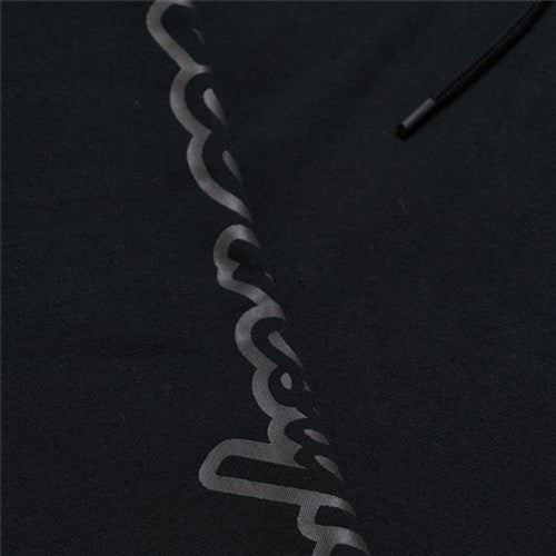 Close-up of the TLD 25.1 Branded Hoodie, perfect for winter, showcasing a matte black cursive logo along one side.