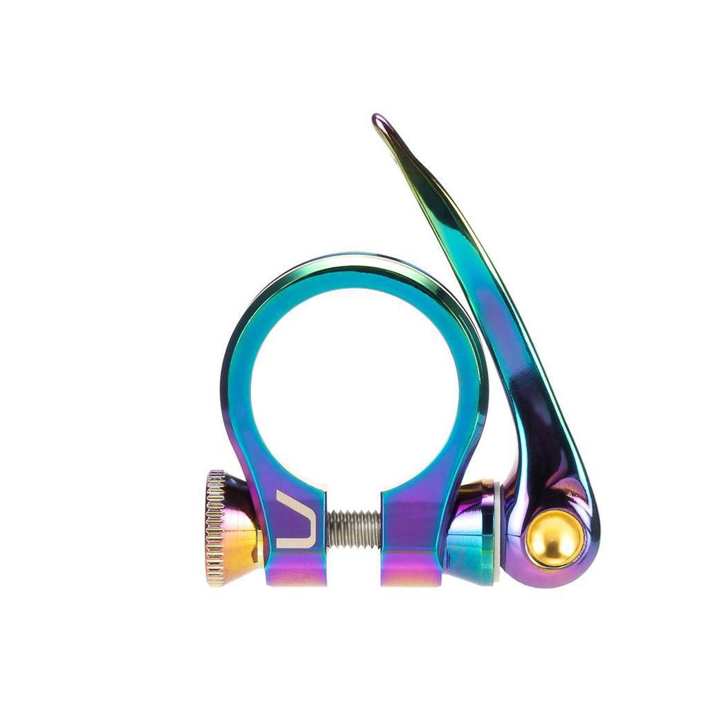 The Arise Ozon Seat Post Clamp is a CNC-machined quick-release clamp with a vibrant rainbow finish and lever, designed for BMX race bikes, and available in 25.4mm or 31.8mm sizes.