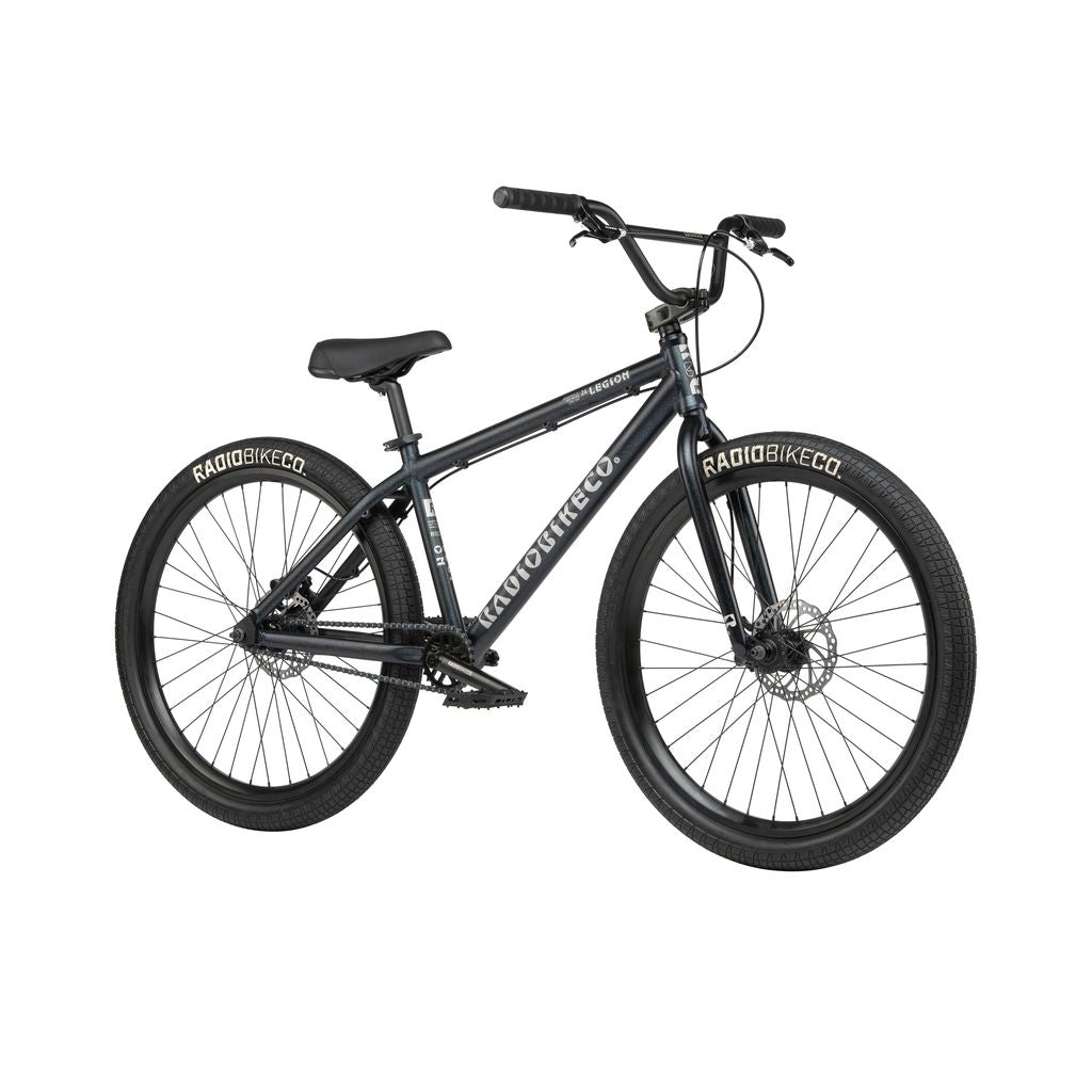 The Radio 26 Inch Legion Bike features a 6061-T6 alloy frame with "RADIO BIKE CO." branding, ensuring durability for all your stunts. This black BMX bike comes equipped with thick tires, a straight handlebar, and a padded seat.