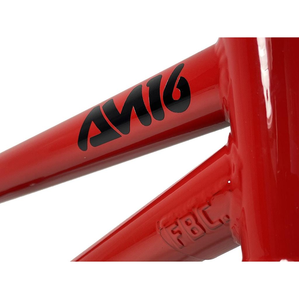 Close-up of a red Fit Bike Co AM 16 Frame & Fork Kit with sleek black "AM16" text and "FBC" near the joint, exuding a high-end feel. Ideal for young shredders seeking style and performance.