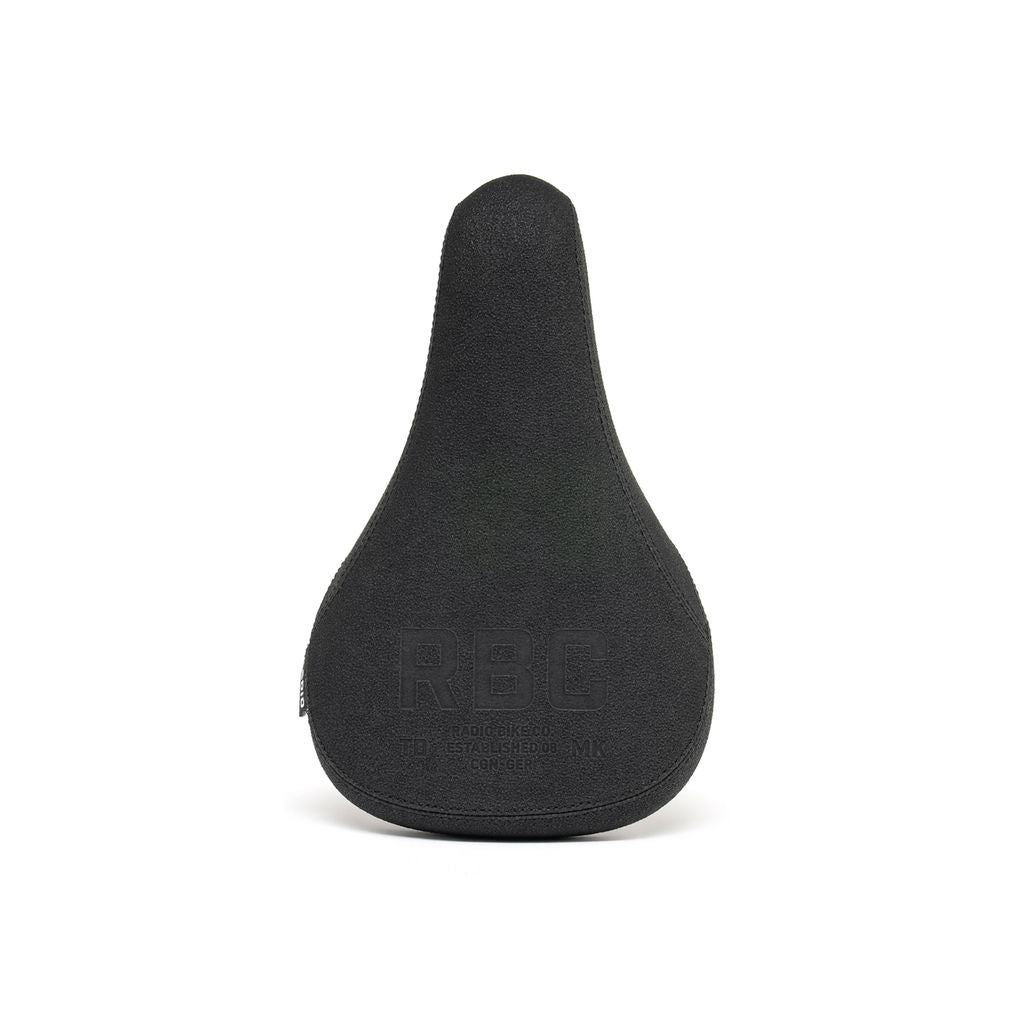 The Radio Century Combo Seat is a lightweight black ergonomic bicycle seat, featuring an embossed "RBC" logo on top and crafted with durable 6061-T6 alloy for comfort and style.