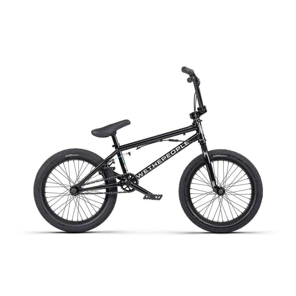 The Wethepeople CRS FS 18 Inch BMX Bike features a black frame with "Wethepeople" text, knobby tires, padded seat, and straight handlebars, ideal for freestyle tricks with its durability and style.