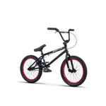 The Radio Saiko 18 Inch Bike is a black BMX with red-rimmed wheels, featuring a Radio Bikes sticker on the frame and equipped with durable Radio Am Chromoly Three Piece Cranks.