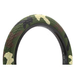 The DRS Arrow FS 20 Inch Tyre features a camouflage pattern in green, brown, and beige, set against a white background.