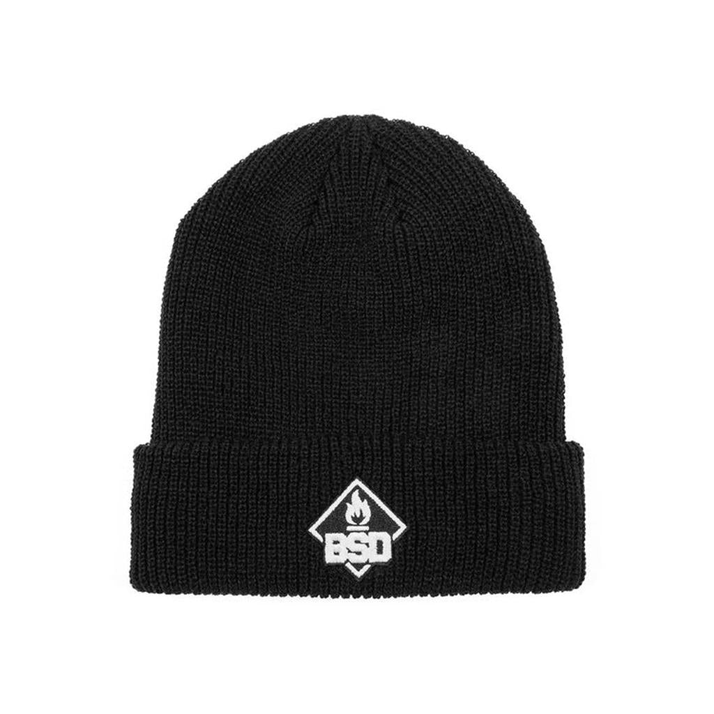 The BSD Roastin Beanie is a black acrylic hat with a folded brim, showcasing a small white "BSD" emblem and flame icon. Made from hypoallergenic materials, it ensures warmth and comfort for sensitive skin.