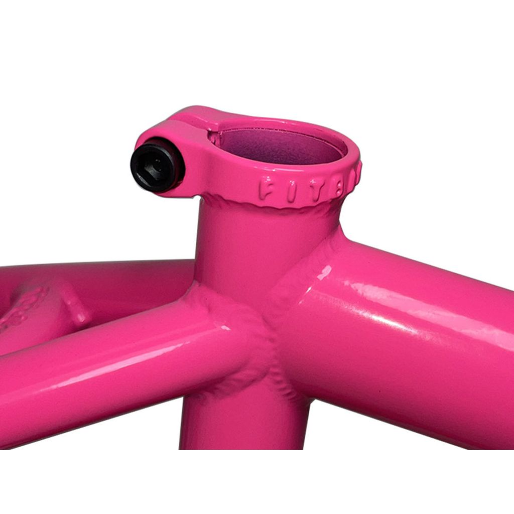 Close-up of a Fit Bike Co Shortcut V2 Frame in Barbie Pink, featuring detailed welding and a seat post clamp—ideal for tech riders seeking style and performance.