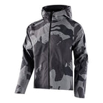 The TLD Descent Jacket, featuring a gray camouflage pattern and front zipper, includes a 3-layer membrane for enhanced protection and is showcased against a plain background.