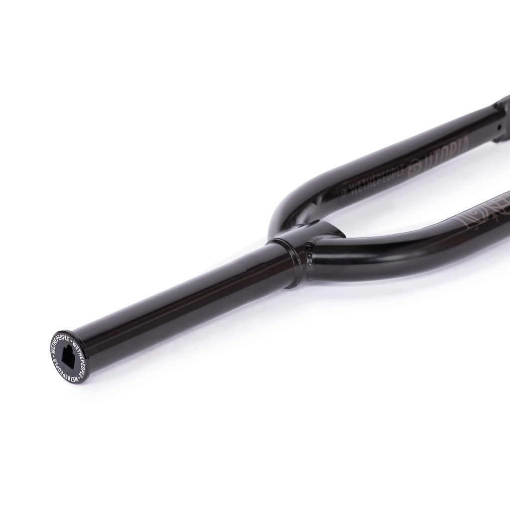 Close-up of the Wethepeople Utopia Zero Fork in black, showcasing its zero-offset design and CNC’d steerer with a flat surface and hexagonal bolt at the end, set against a white background.