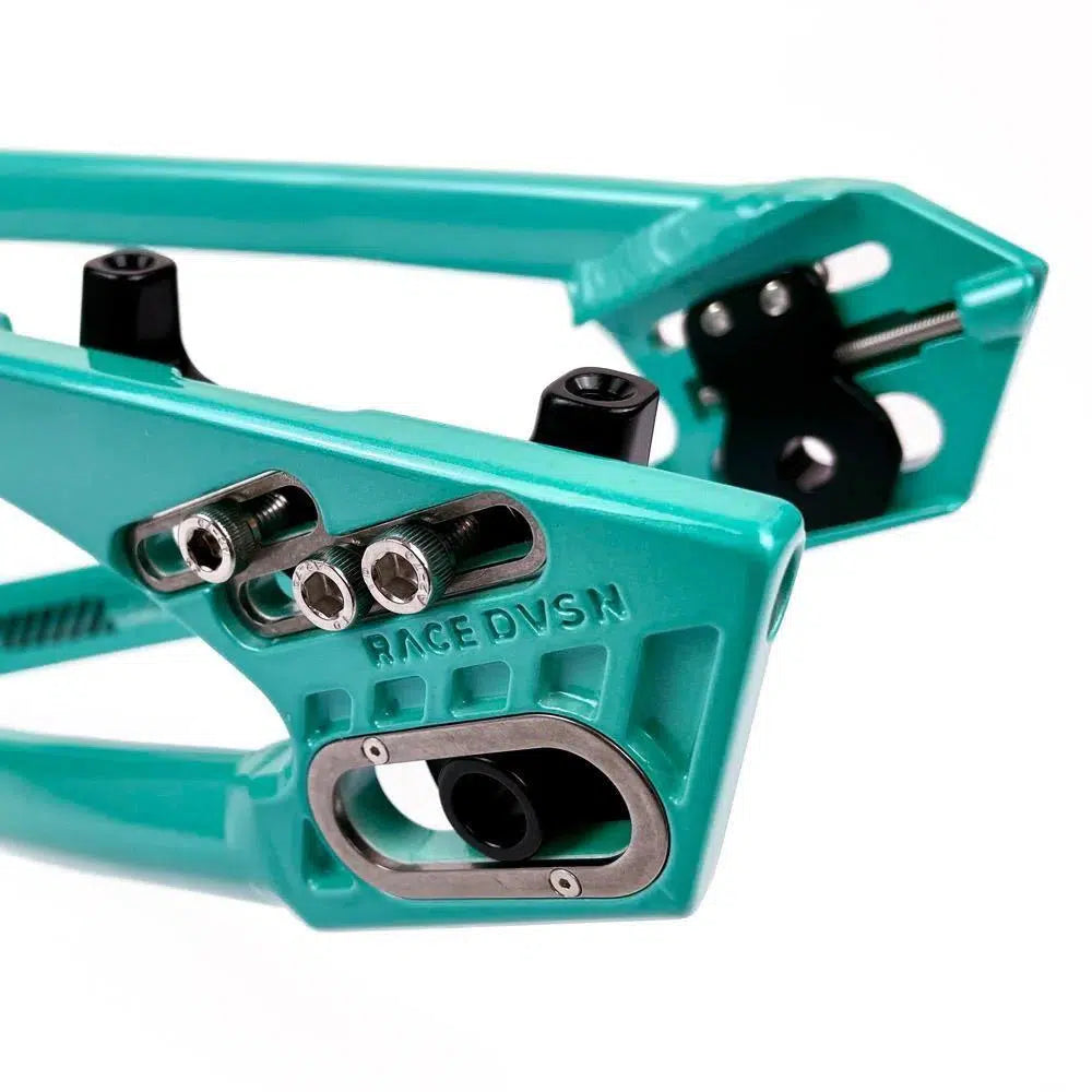 Close-up of a turquoise Staystrong V5 Disc Pro XXXL Frame with detailed mounting hardware, prominently showing the brand "RACE DVSN," crafted from 6061 alloy tubing for superior strength and durability.