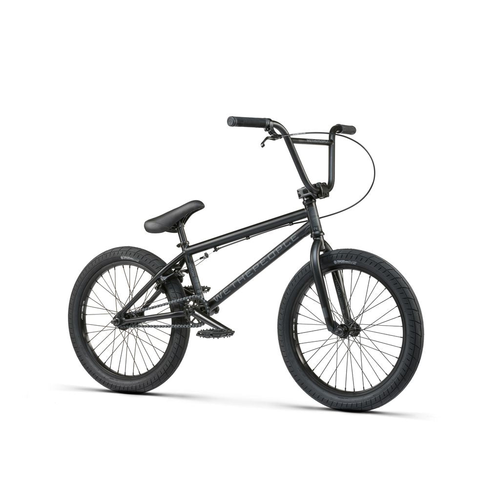 Introducing the Wethepeople Nova 20 Inch Bike: a black BMX featuring a compact frame, thick tires, and single gear system. It includes Salt Rookie Cranks and a sealed headset for smooth rides and reliable performance on any terrain.