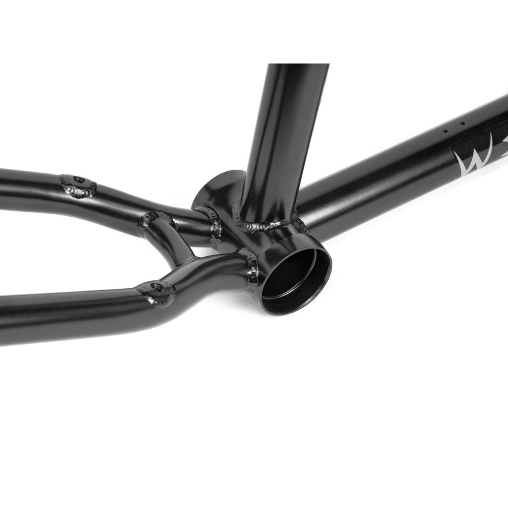 Close-up of the Wethepeople Chaos Machine 22 Frame's bottom bracket area, highlighting its welding details and two tubes connecting to the main frame, showcasing Tyson Jones-Peni Signature trail geometry.