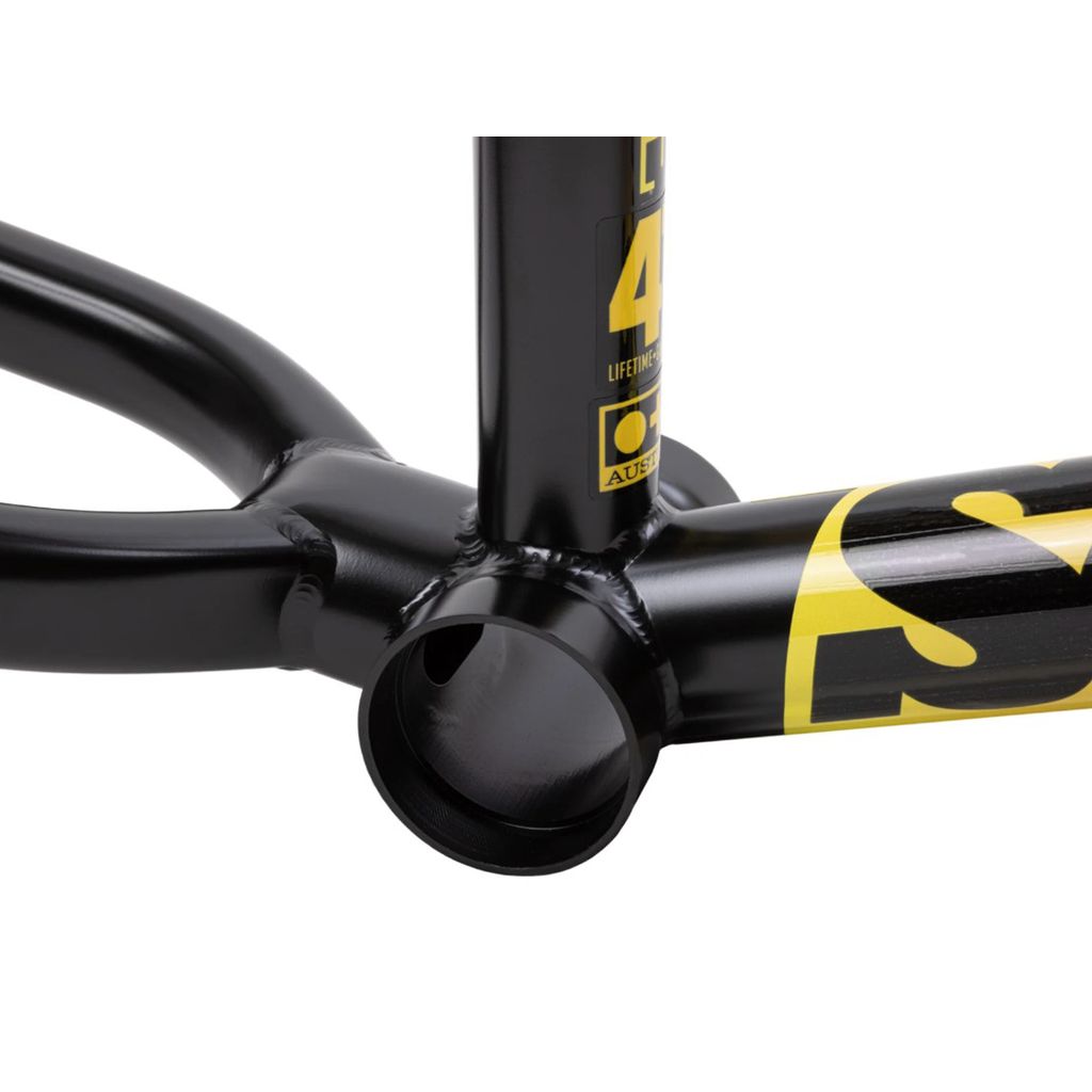 Close-up of a black Sunday Soundwave V3 frame's bottom bracket area with yellow decals. The welded joints and tubing are clearly visible, showcasing the 41 Thermal Process that makes this frame both lightweight and strong.