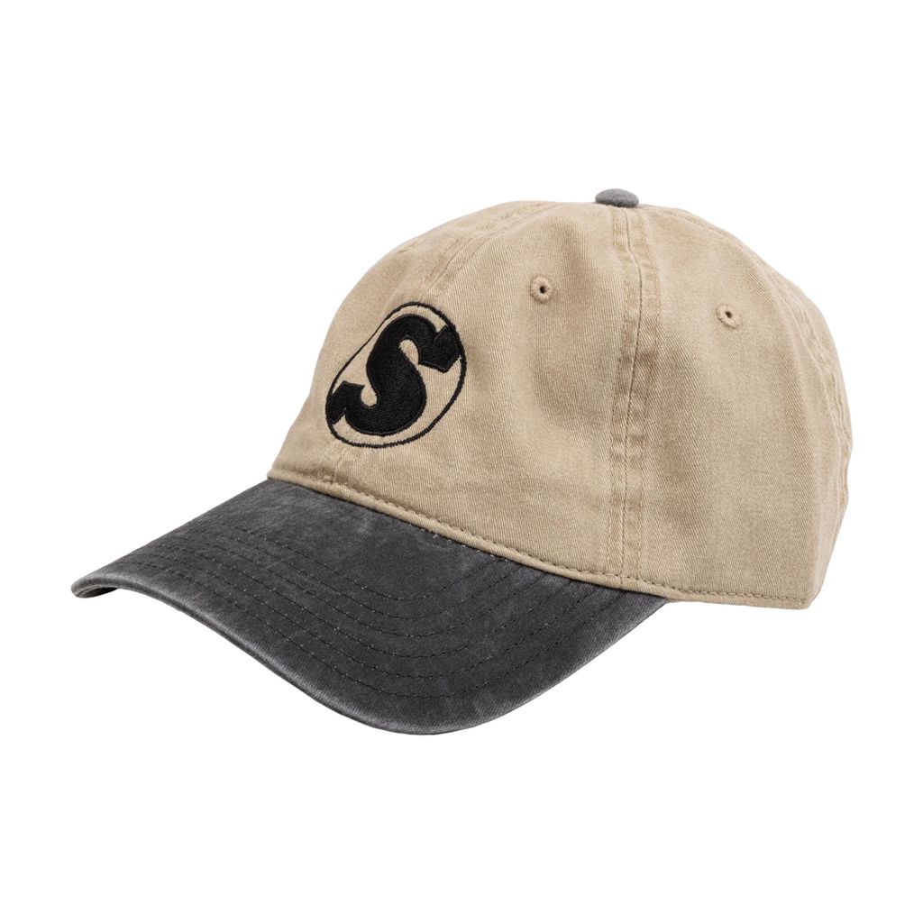 Introducing the Sunday Dad Badge Cap: a stylish beige and black dad cap showcasing an embroidered 'S' logo on the front. It features a classic strap back closure and is crafted with a 6-panel construction for maximum comfort.