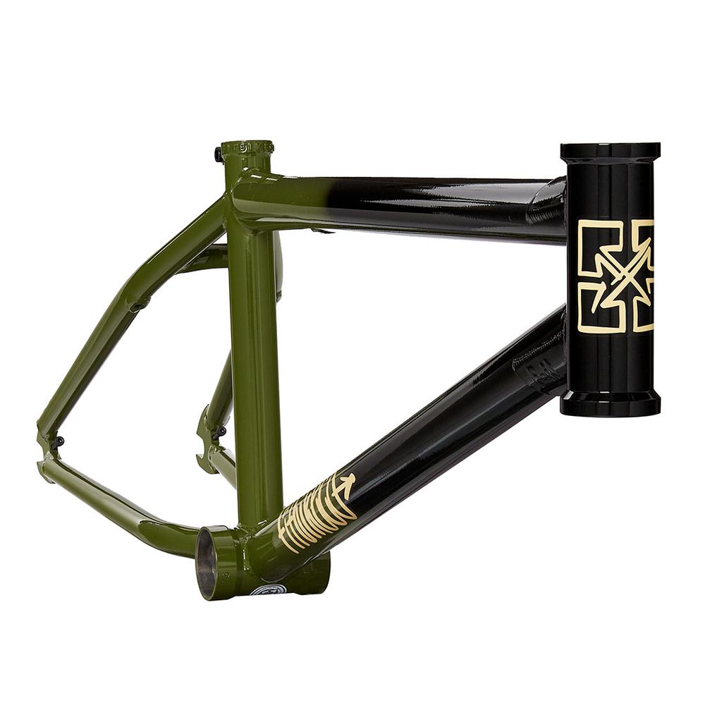 The Fit Bike Co Shortcut Frame features an olive green and black BMX design with gold accents on the head tube and middle bar, offering responsive geometry perfect for tech riders.