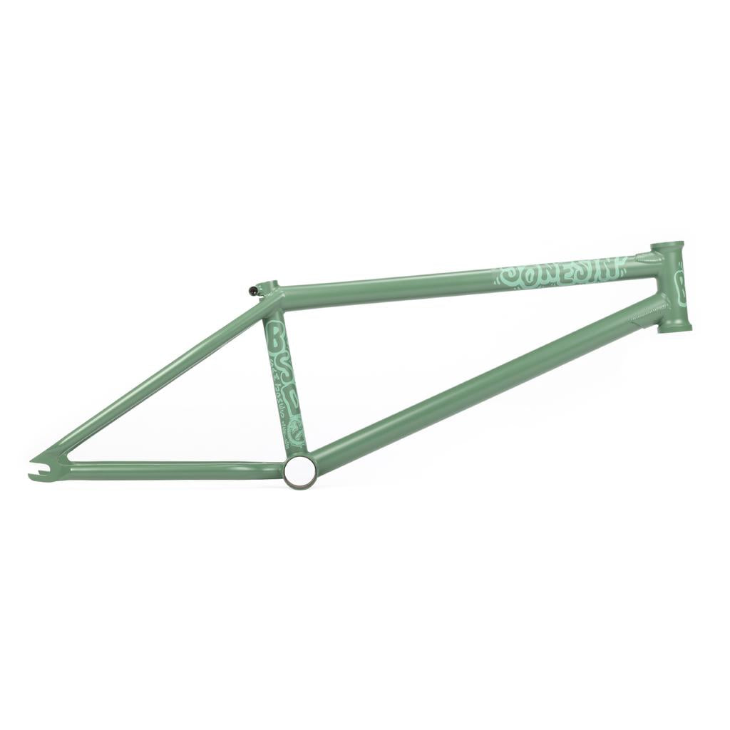 The BSD Jonesin Frame (2021) features a green frame on a white background, highlighting the "Bonesaw" design with logo text. As Sam Jones' signature model, it offers modern street geometry for urban riders who prioritize style and performance.