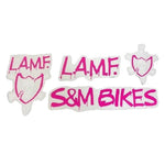 A set of four stylish S&M LAMF frame decals with pink text and graphics, perfect as replacements. Text reads "L.A.M.F." and "S&M BIKES" and includes a striking skull emblem.