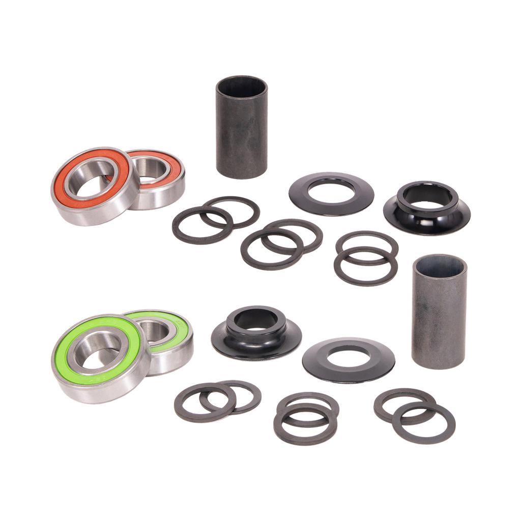 The Salt Rookie Mid Bottom Bracket is displayed on a white background, featuring sealed bearings with green and orange seals, 19mm spindle cranks, sleek metal sleeves, and black washers.