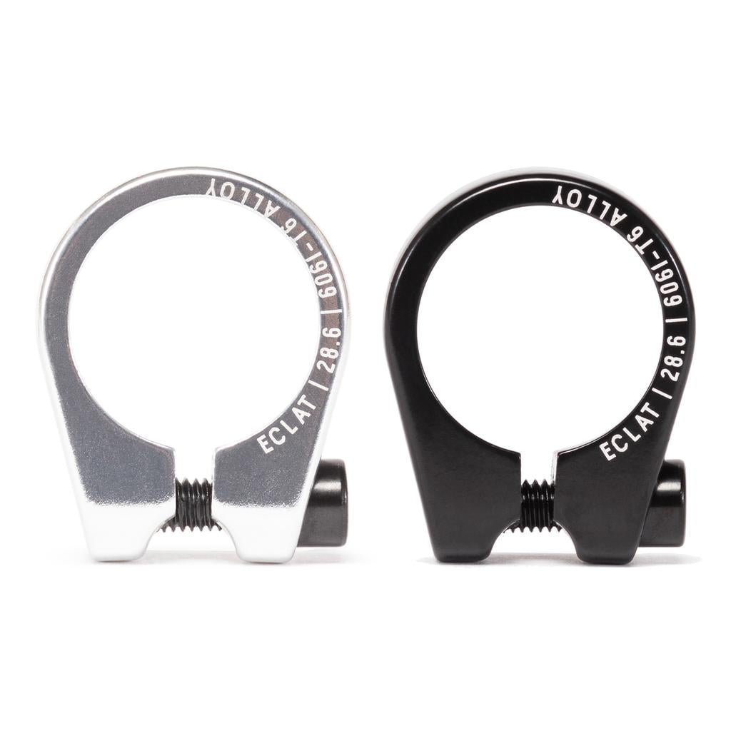 Two Eclat Pure Seat Clamps made from 6061-T6 alloy, showcased on a white background, display "ECLAT" and specifications engraved. One clamp is silver, and the other is black.