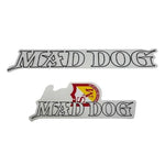 The S&M Mad Dog Frame Decal Set includes two stickers with "MAD DOG" in black outlined font; the bottom sticker has a red and yellow shield design for an eye-catching look.