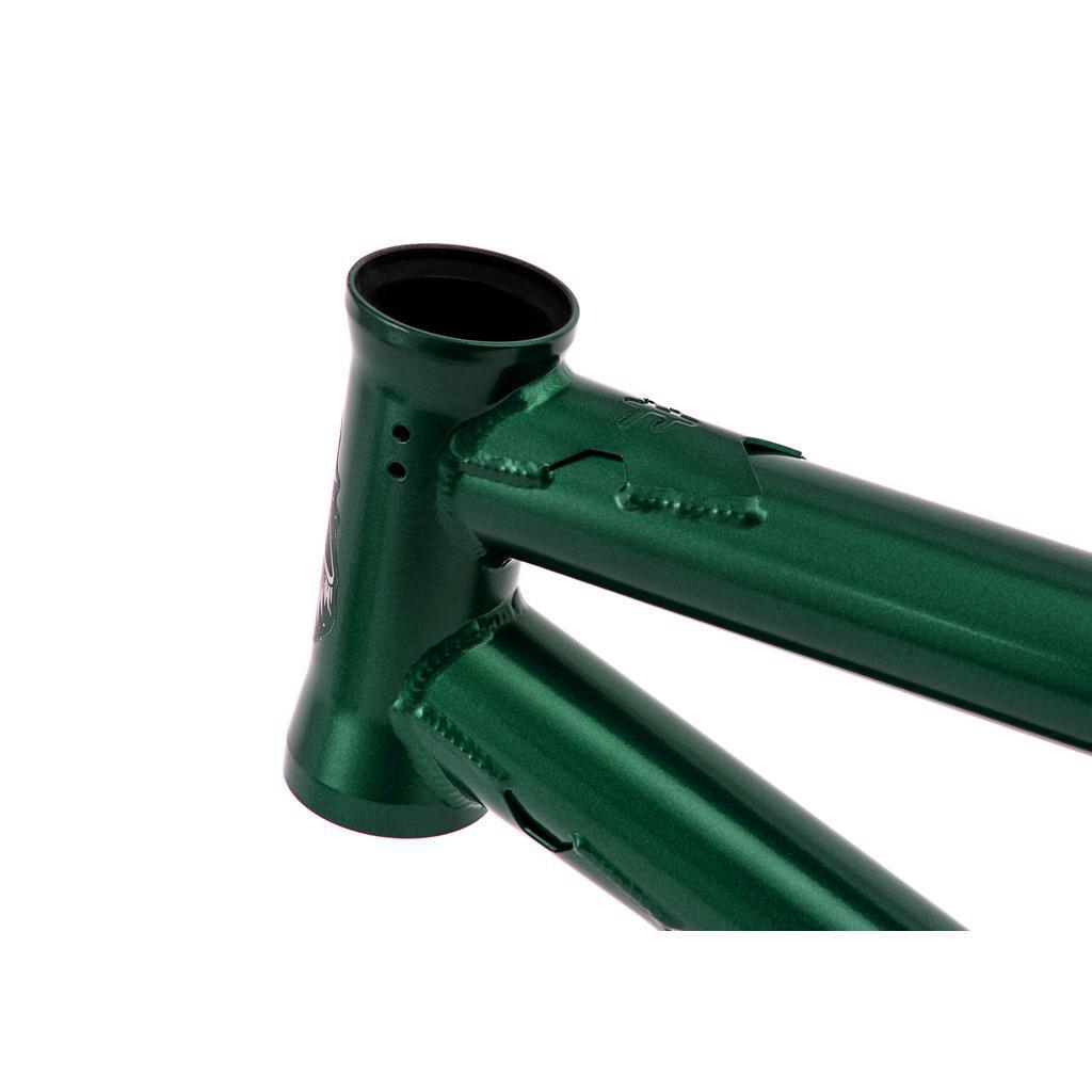 Close-up of a Fly Bikes Aire Frame in green, made from 4130 Cr-Mo, featuring the glossy top tube and head tube against a white background.