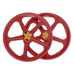 The Skyway Tuff II Rivet 20 Collectors Edition Wheelset features red bicycle wheels designed for BMX bikes, showcasing five spokes and eye-catching yellow hubs. Adorned with the brand logo on the rims, these wheels are perfect for retro rebuilds or adding a touch of sophistication to any ride.