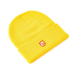 A S&M Zissou Beanie with a folded brim and a small embroidered red and white shield logo.